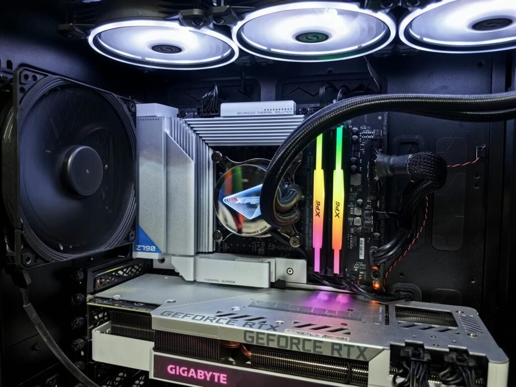 Close-up of a gaming PC setup showcasing internal components and RGB lighting.